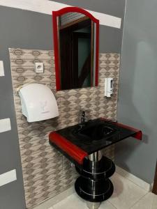 a bathroom with a black sink and a mirror at 2 bedroom apartment in Musanze( Benji) in Ruhengeri