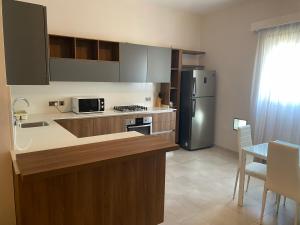Kuchyň nebo kuchyňský kout v ubytování Tranquil 2 Bedroom Apartment in the Heart of Sliema