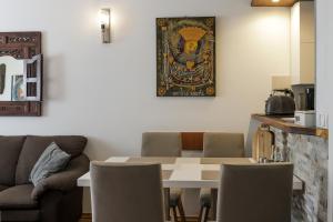 een eetkamer met een tafel en stoelen bij AP PR11 in one of the most luxury building in Omis in Omiš