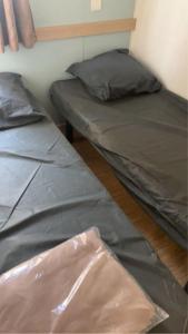 Llit o llits en una habitació de Mobil-home Camping - La Marine - Grau du Roi