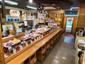a buffet line in a restaurant with food on display at Hotel Alpha-One Matsue in Matsue