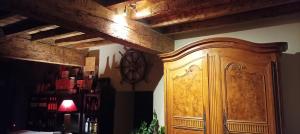 a wooden cabinet in the corner of a room at Domaine Le Clos du Figuier Spa Grisolles in Verdun-sur-Garonne
