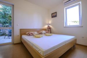 Postel nebo postele na pokoji v ubytování Celtis Apartment