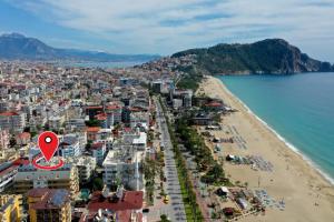 an aerial view of a beach with a red marker at Kleopatra Ada Suites & Apartments in Alanya
