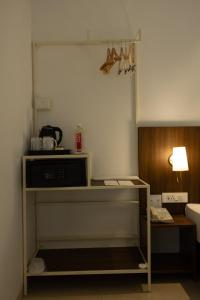 Ein Bett oder Betten in einem Zimmer der Unterkunft Freesia Residency By Express Inn - Navi Mumbai