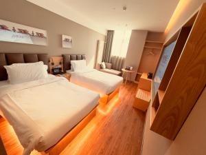 Voodi või voodid majutusasutuse True Go Hotel - Beijing Asian Games Village National Convention Center toas