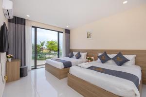 Giường trong phòng chung tại Palm Villa 36 (Luxury Villa inside Resort near The Sea)