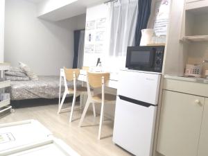 O bucătărie sau chicinetă la XL Shinjuku House