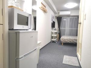 O bucătărie sau chicinetă la XL Shinjuku House +27 fotografii