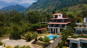 an aerial view of a house with a swimming pool at Dream Seven Hotel - Haputale in Haputale