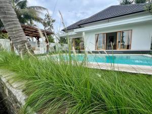 Bazén v ubytování Padi-Padi Pool Villas nebo v jeho okolí