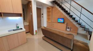 TV a/nebo společenská místnost v ubytování TreeParkCity apartments by WinsHome