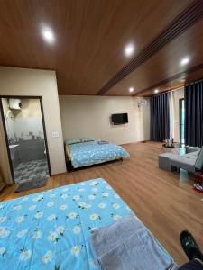 Säng eller sängar i ett rum på Mộc Châu Homestay