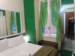 Postel nebo postele na pokoji v ubytování Enjoy Roma