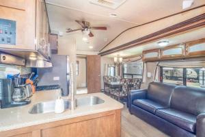 a kitchen and living room of an rv at Moab RV Resort RV IV Fully Setup OK44 in Moab