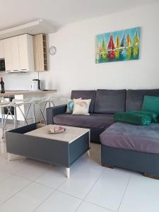 a living room with a couch and a coffee table at SEA VIEW APARTMENTS in Costa Calma