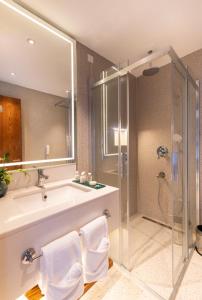 a bathroom with a sink and a shower at Voger Alaçatı Prive in Cesme