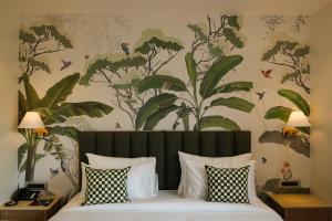 a bedroom with a bed with a floral wallpaper at The LIV Hotel Jaipur in Jaipur