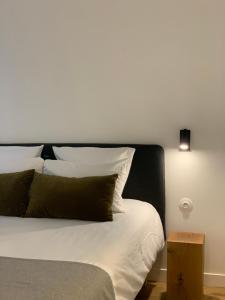Postel nebo postele na pokoji v ubytování Appart Hôtel Victoria