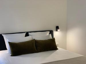 Postel nebo postele na pokoji v ubytování Appart Hôtel Victoria