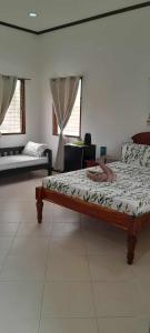 a bedroom with a bed in a room at Bonita Oasis Beach Resort in Moalboal