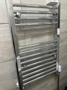a stainless steel drawer in a shower stall at 2nd Studio Flat With Great Views in Keedonwood Road With Private Kitchenette and shared bathroom in Bromley