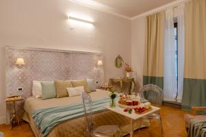 Posteľ alebo postele v izbe v ubytovaní Accanto Al Centro B&B