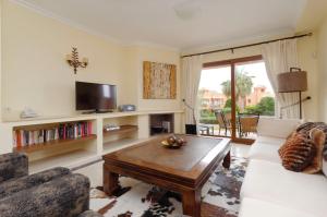 a living room with a couch and a coffee table at Paradise in la Manga Club in Murcia