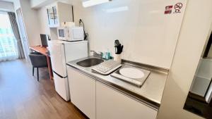 Kuchyň nebo kuchyňský kout v ubytování Apartment Hotel Ecott