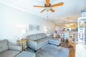 a living room with a couch and a ceiling fan at Sea Breeze 311 Deluxe in Biloxi