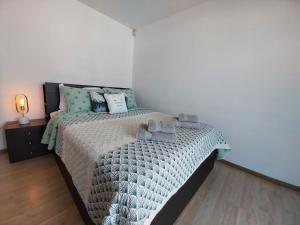 A bed or beds in a room at Coco De Mer 408