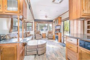 an interior view of a kitchen in a recreational vehicle at Moab RV Resort Outdoor Glamping Destination RV OK40 in Moab