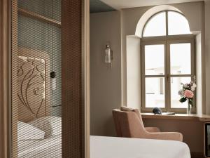 Postel nebo postele na pokoji v ubytování Domus Blanc Boutique Hotel