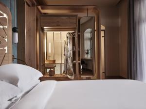 Postel nebo postele na pokoji v ubytování Domus Blanc Boutique Hotel