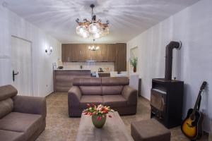 a living room with a couch and a stove at Villa Marco Polo with swimming pool in Budva