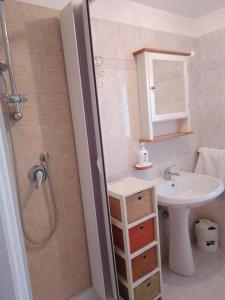 a small bathroom with a sink and a shower at Allegra Fattoria in Veiano +14 photos