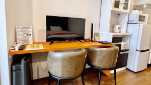 Kuchyň nebo kuchyňský kout v ubytování Apartment Hotel Ecott