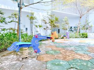 two plastic toy horses on a stone patio at Silverscape Seaview Residence Melaka in Melaka