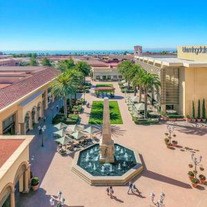 an aerial view of a mall with a fountain and a monument at Datu - Discover world with us in Newport Beach