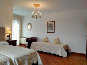 Säng eller sängar i ett rum på Hosteria De Langre