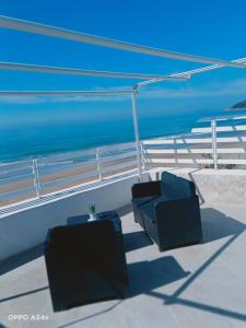two chairs sitting on the deck of a boat at PALOMERA LUXURY APARTMENT SUL MARe in Gaeta