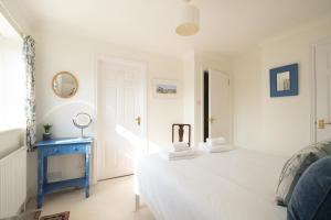 Postel nebo postele na pokoji v ubytování Harvest Cottage