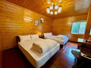 南苑莊園 NanYuan Resort Manor客房内的一张或多张床位