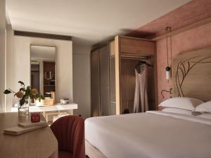 Postel nebo postele na pokoji v ubytování Domus Blanc Boutique Hotel