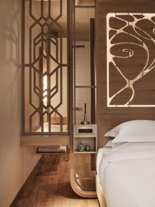 Postel nebo postele na pokoji v ubytování Domus Blanc Boutique Hotel