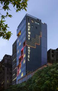 a building with a sign on the side of it at Popway Hotel in Hong Kong
