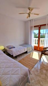 En eller flere senge i et værelse på Casa Buganvilla + 37 billeder