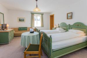 Postel nebo postele na pokoji v ubytování Villa Egger
