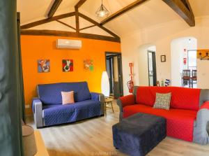 a living room with two chairs and a couch at Vila Arrifes Guesthouse Upstairs in Ponta Delgada