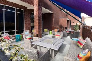 a patio with wicker chairs and a table at Hampton Inn & Suites - Raleigh Downtown in Raleigh